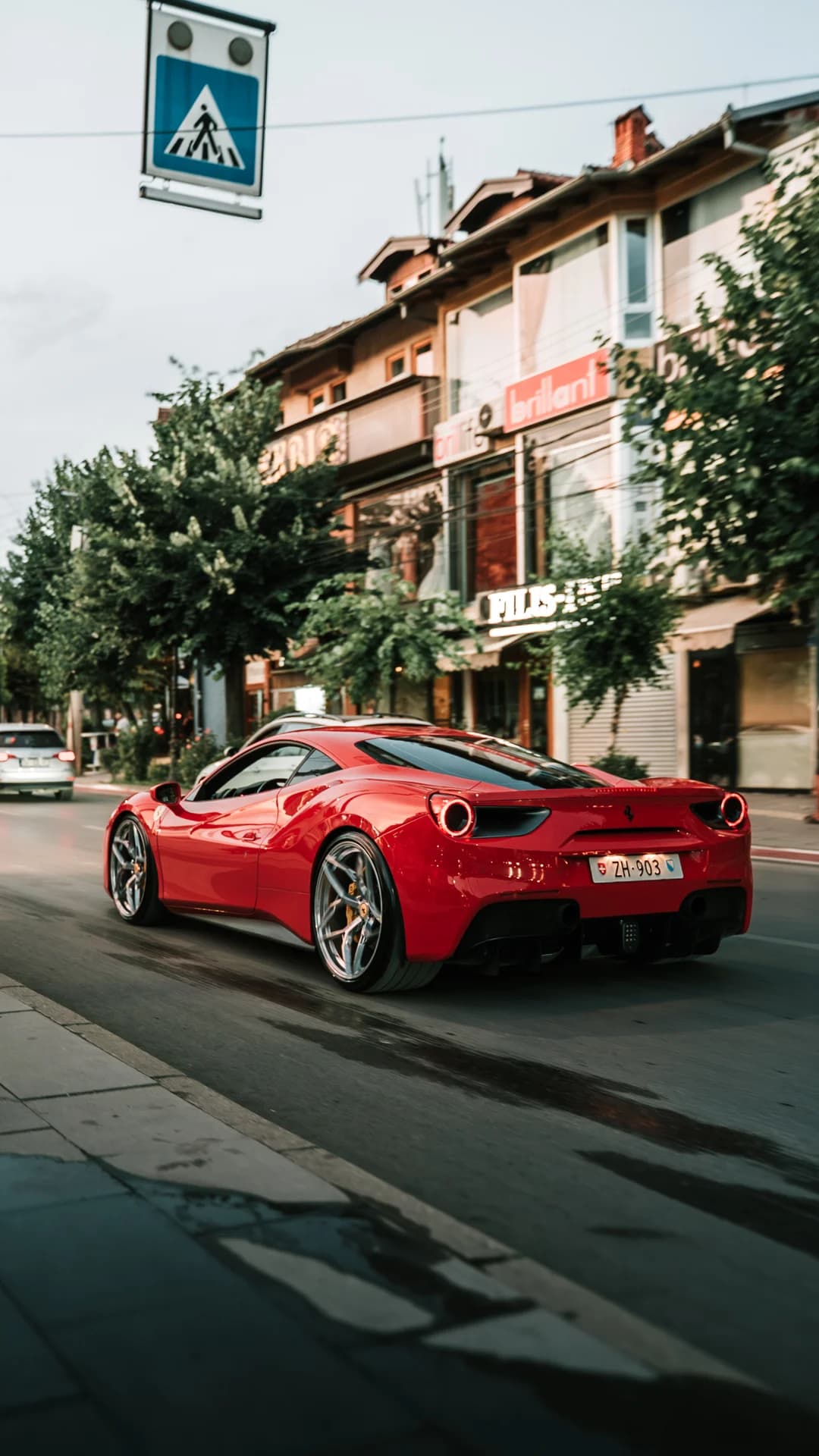 Red Ferrari on a European street