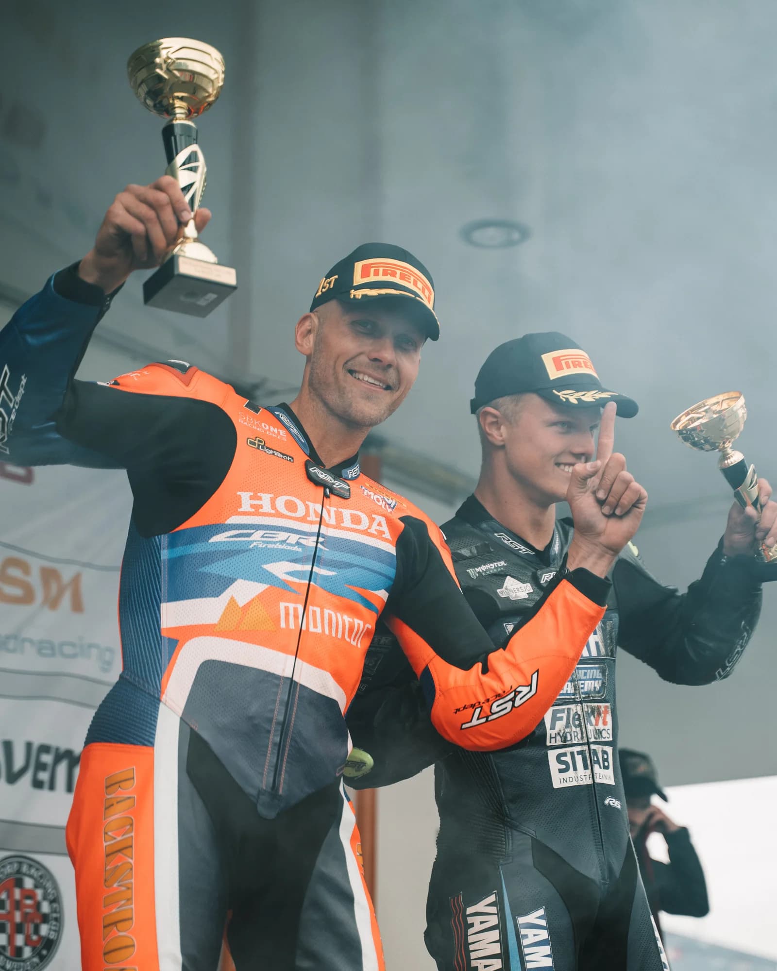 Race winners celebrating on the podium